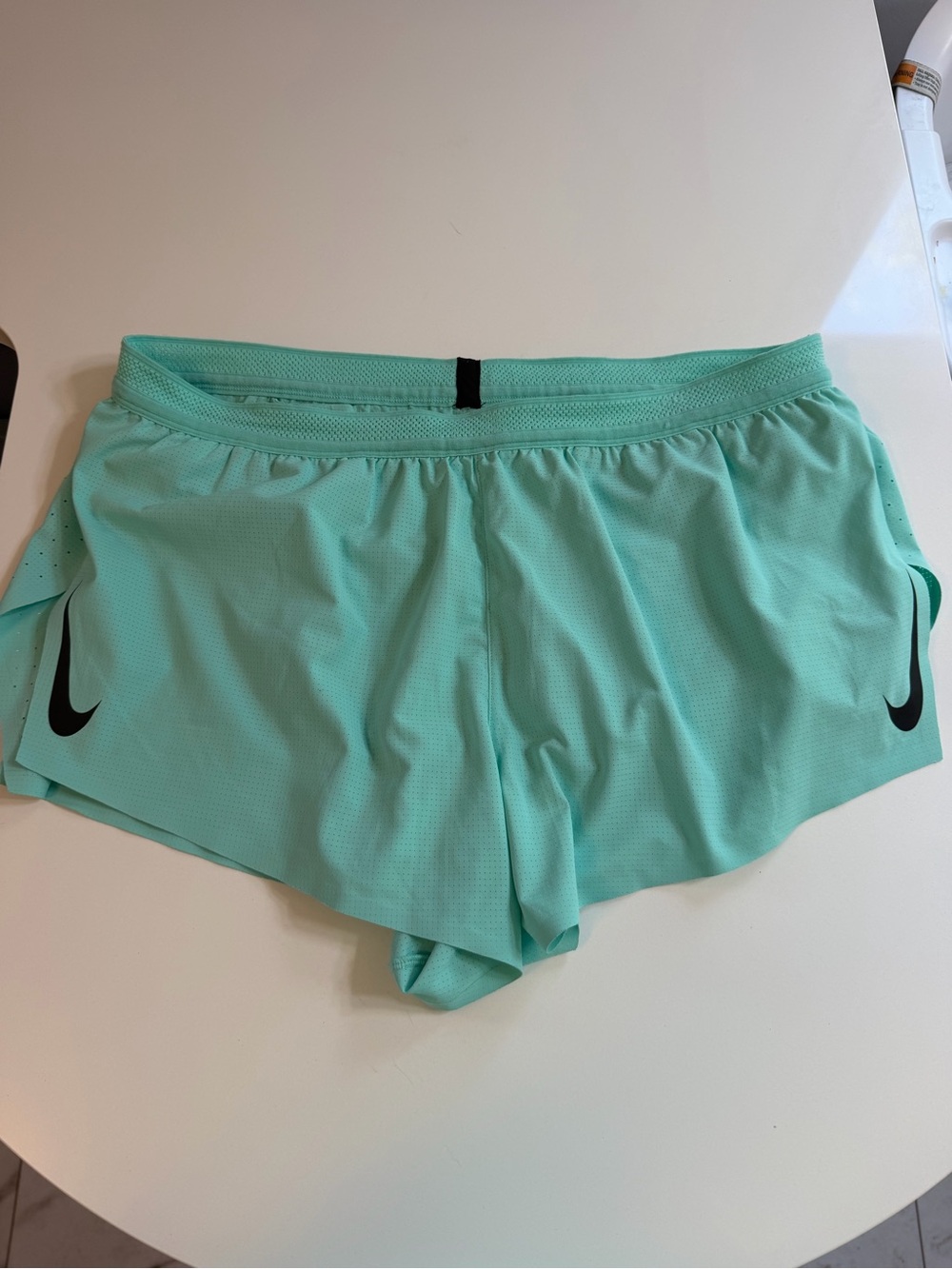 Nike Women's Mint Green Running Shorts with Black Swoosh